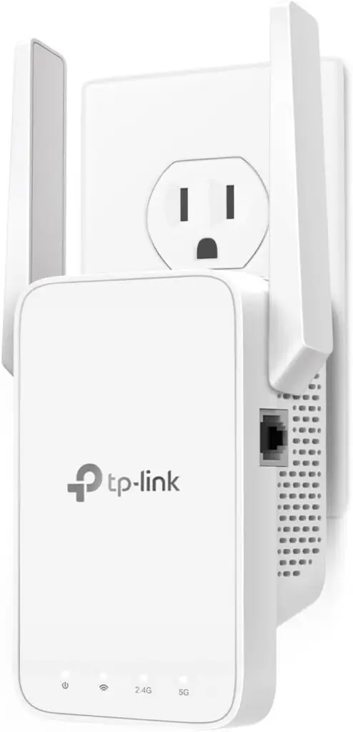 TP-Link AC1200 WiFi Extender (RE315) plugged into a wall outlet in a modern living room.