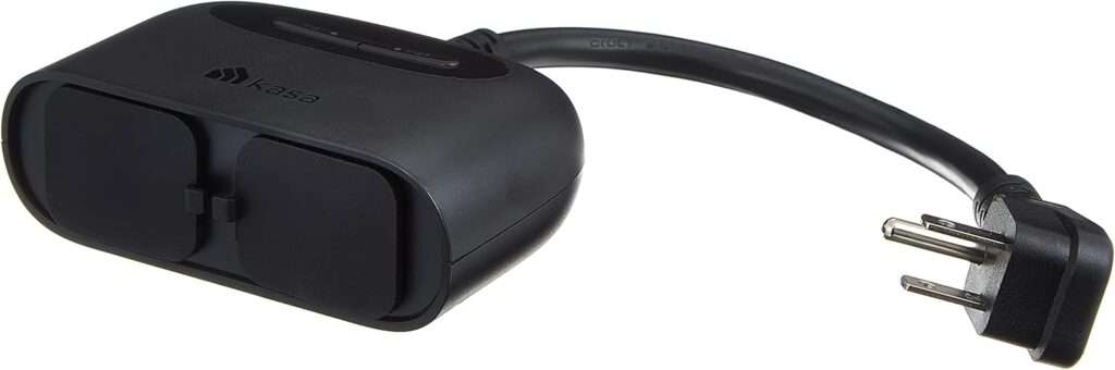 Kasa EP40A Outdoor Smart Plug installed in a garden with string lights.
